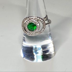 Silver toned double halo emerald ring